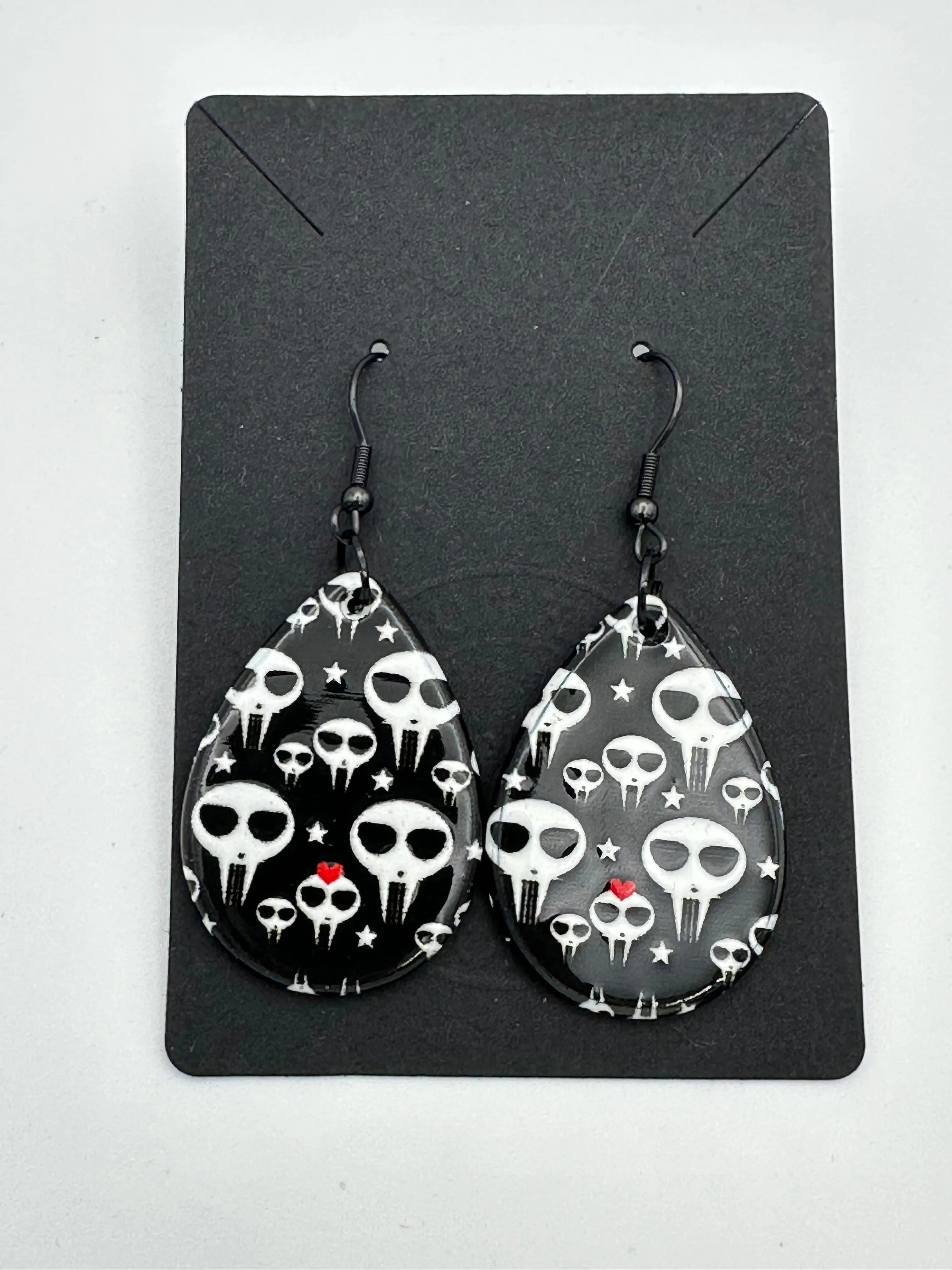 Black and white alien skull earrings