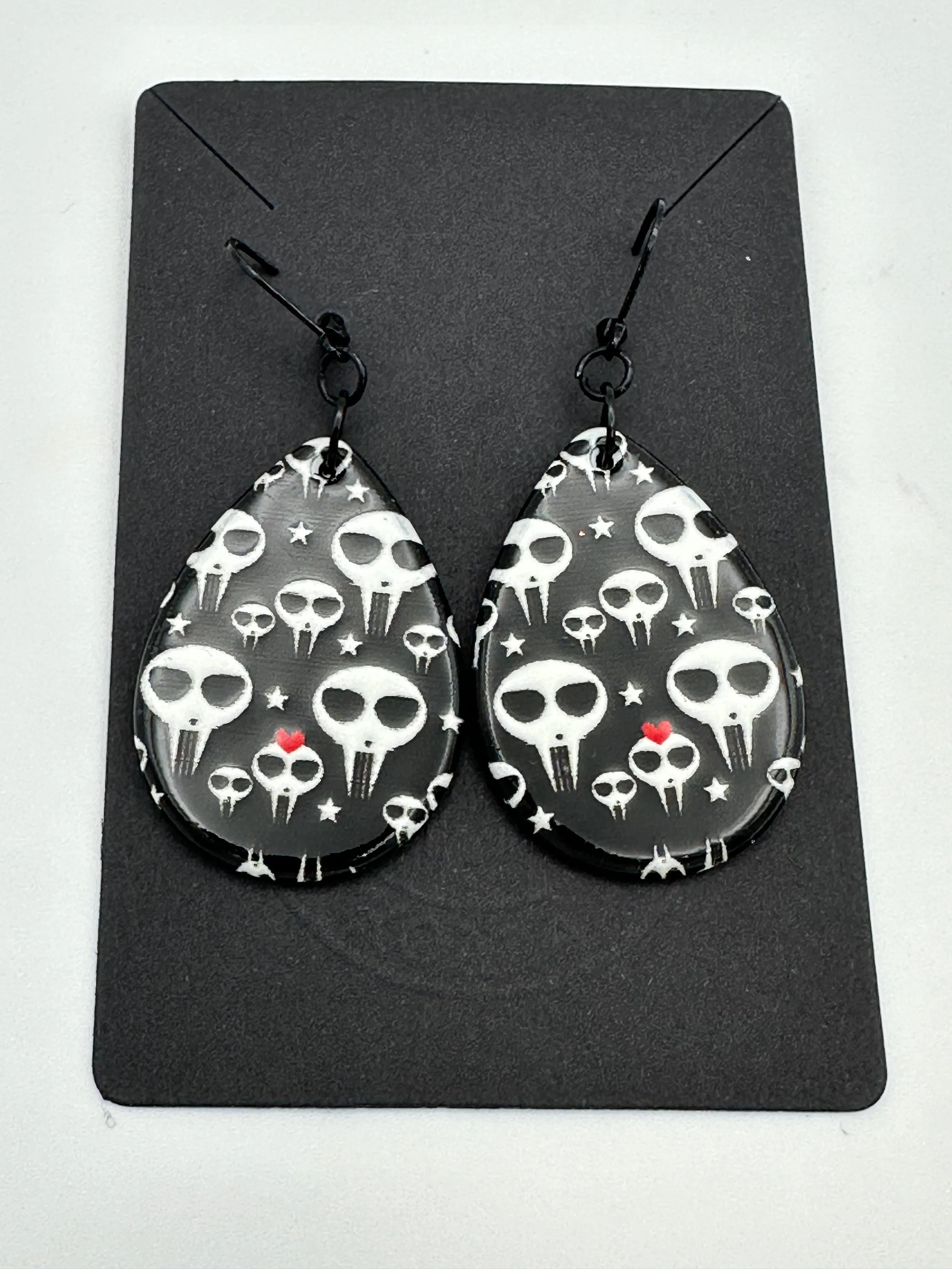 Black and white alien skull earrings